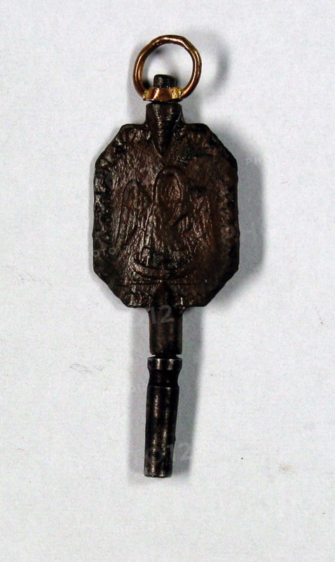 Clock key with Masonic motifs.