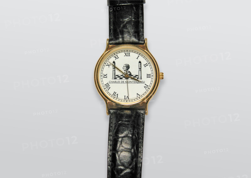 Circular watch on a strap.