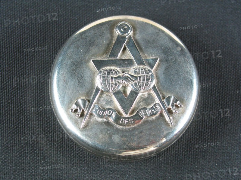 Silver-plated metal case.
