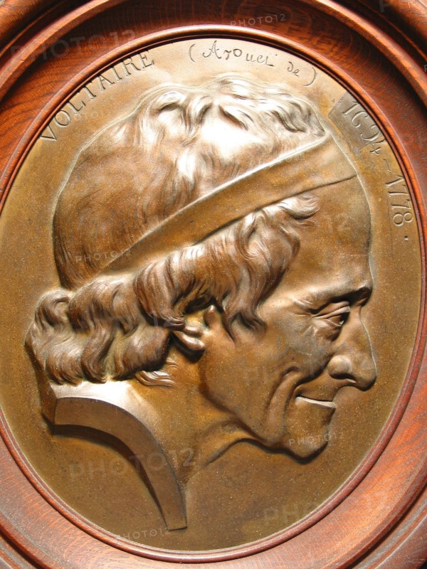 Wooden medallion in an oval frame depicting Voltaire