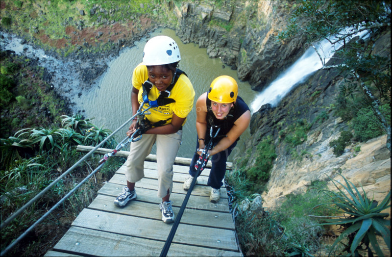 abseiling next to a waterfall