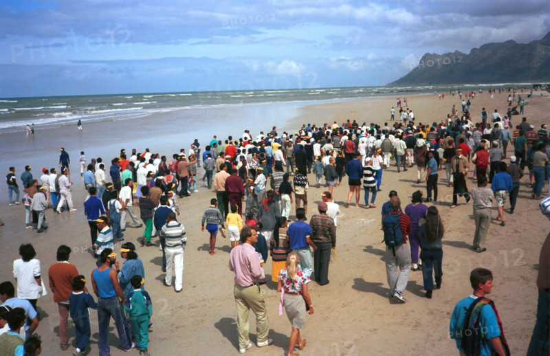 The Strand, Cape Town, South Africa, 1989

water, sand, beach, coloured people, demonstrations against segregation, fighting apartheidm multiracial