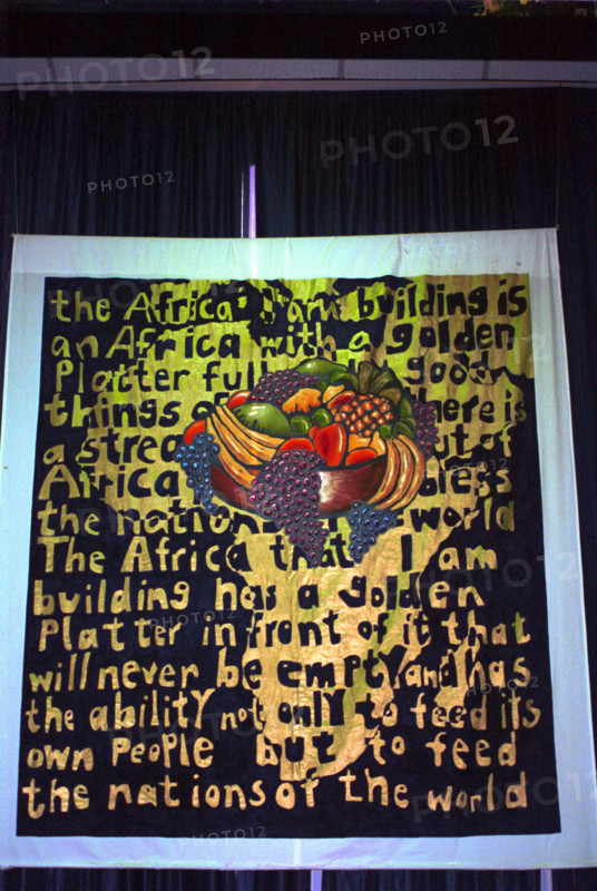 Prophetic banner at a Christian conference.  "The Africa I am building is an Africa with a golden platter full of good things.  There is a stream out of africa that will bless the nations of this world.  The Africa that i am building has a golden platter in front of it that will never be empty and has the ability, not only to feed its own people, but to feed the nations of the world.
Bloemfontein, Freestate, South Africa
fruit bowl, art, artists, banners