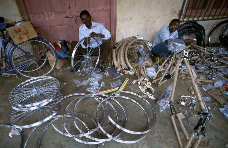MAN REPAIRING BICYCLES, MALAWI