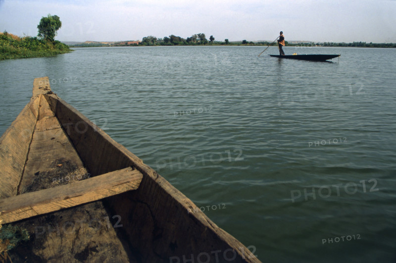 Bamako is not even half way along the length of the Niger River yet even here it is a large body of water a kilometre or so wide. The river sustains the life on its banks including Bamako. Away from the river the landscape quickly becomes arid. Fishermen in long, fairly unstable canoes, work these waters using gill nets, and selling their catch in the city markets.