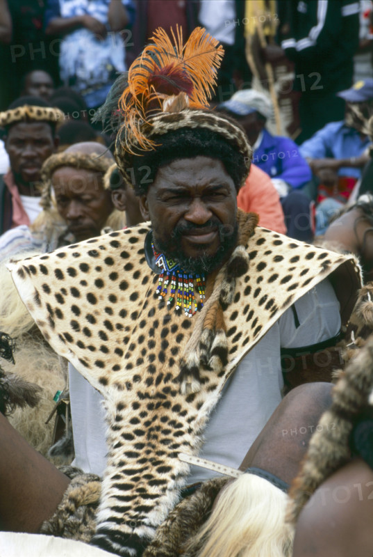 Heritage Day in South Africa Coincides with the Zulu celebration of Shaka Day in honour of the founding king of the Zulu nation. On this day the Zulu King, currently King Goodwill Zwelithini, the Zulu Royal Family, the chiefs and large crowds of Zulu subjects in traditional clothing gather to celebrate. There are speeches, but there is also much dancing and singing. 

It was during the speeches when all the press cameras were turned on the King and Zulu politicians of the likes of former vice president Jacob Zuma, that I managed to get close to a group of amakhosi (chieftains) to take individual portraits. It is a sign of disrespect to look an older man, and particularly an "inkosi" in the eye so I had to work carefully. I kept low and my subjects were fortunately gracious.