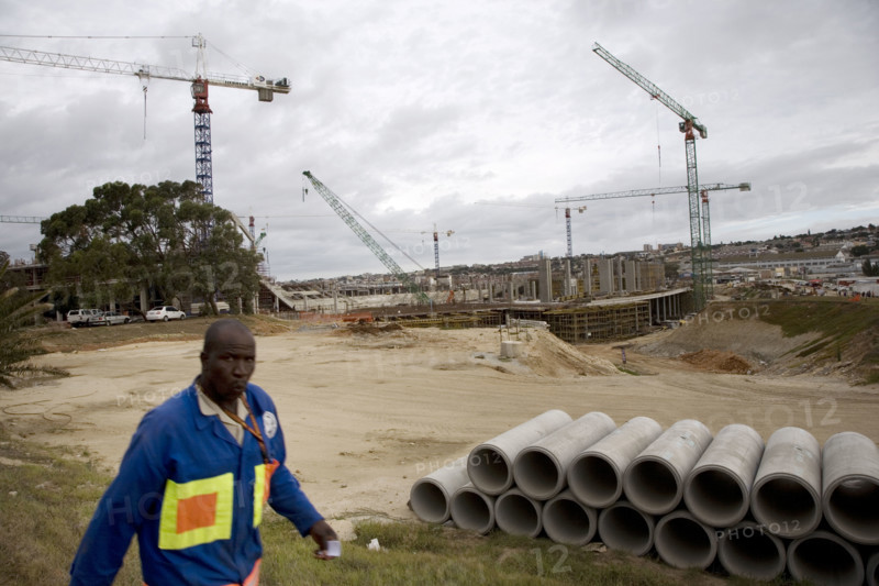 A worker knocks off work at the end of the day on the construction site of the Nelson Mandela Bay Stadium in Port Elizabeth. The stadium in the Eastern Cape will host seven matches, including one of the semi-finals. It is a new stadium, being built especially for the 2010 FIFA World Cup‚ 2010 Soccer World Cup.