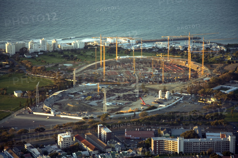 Seen from Signal Hill, construction cranes rise above the site of the new Greenpoint Stadium in Greenpoint, Cape Town. The all-weather stadium is designed to seat 70,000 people. The Stadium is one of 10 that will be used in the 2010 FIFA World Cup‚ 2010 Soccer World Cup