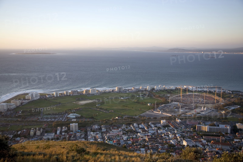 Seen from Signal Hill, construction cranes rise above the site of the new Greenpoint Stadium in Greenpoint, Cape Town. The all-weather stadium is designed to seat 70,000 people. The Stadium is one of 10 that will be used in the 2010 FIFA World Cup, 2010 Soccer World Cup