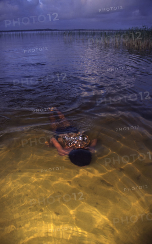swimmer -underwater in a lake