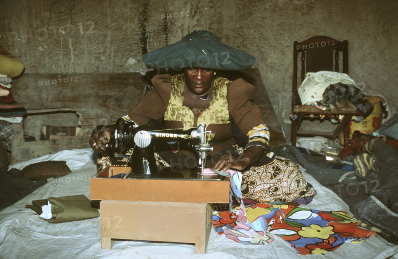 Herero woman sewing