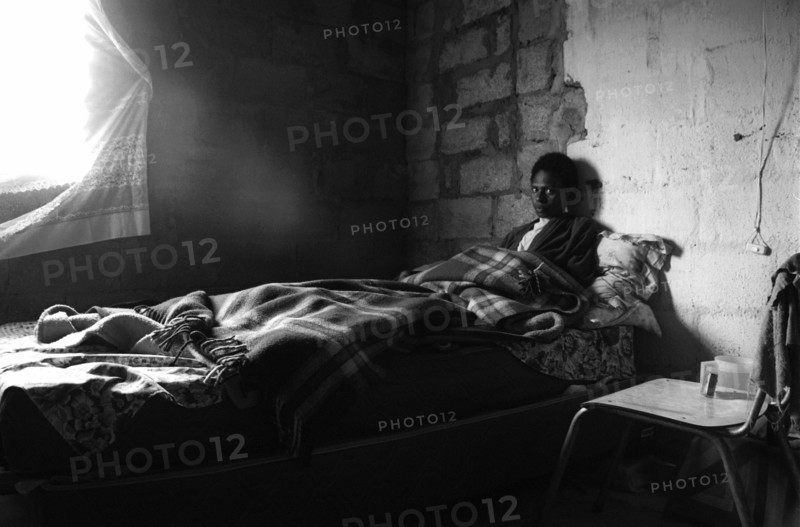 A young woman sick in bed