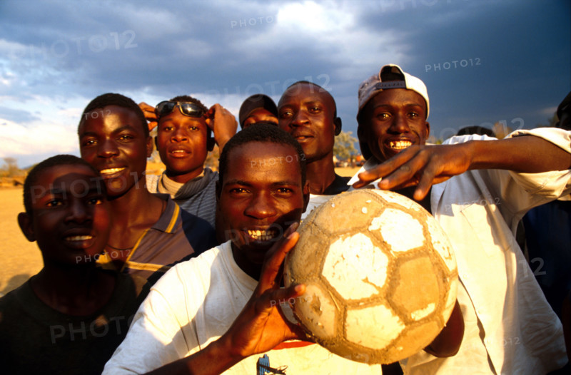 Farm workers   forget the insecurity of their position in a game of soccer