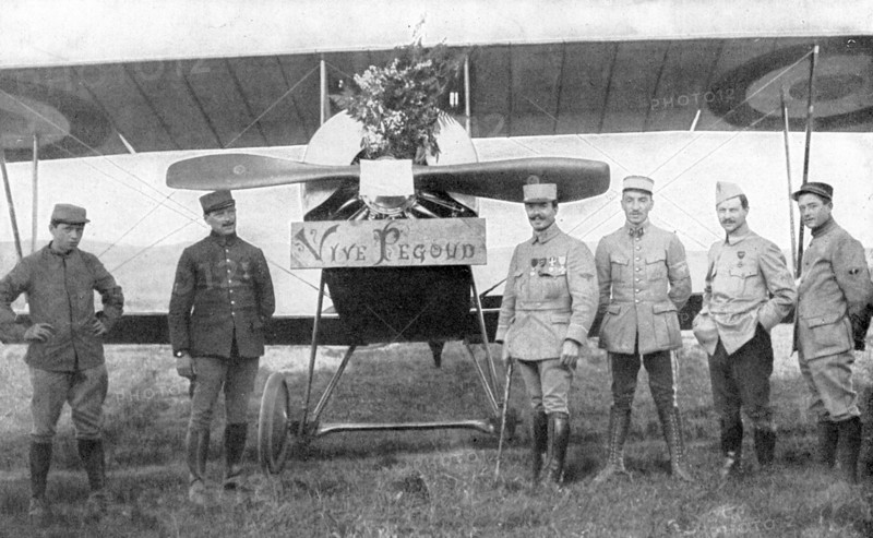 French Air ace Adolphe Pegoud, 4th from right, in front of his plane