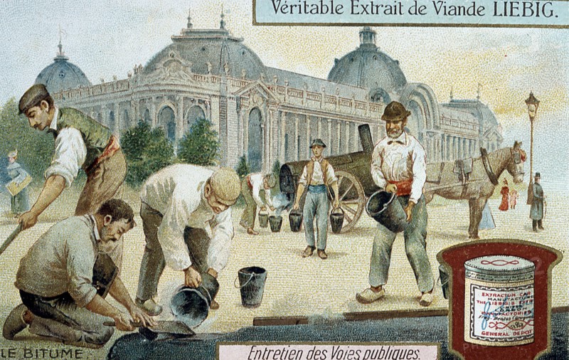 Laying bitumen road surface in a Paris street