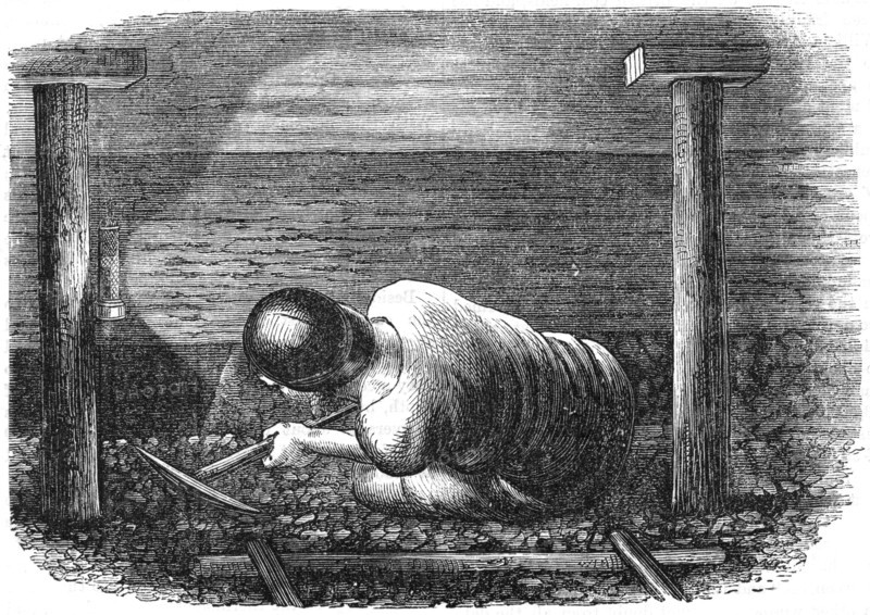 Miner working a seam with a pick 'scuffling' out the coal