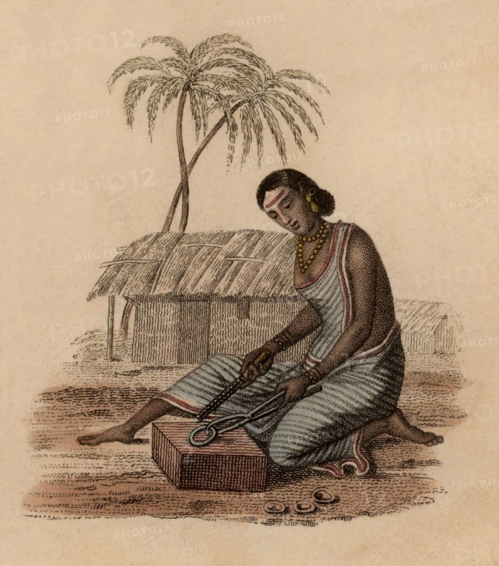 India : brazier's wife filing imperfections from a small brass artefact