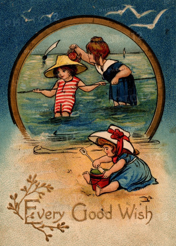 Children paddling and playing on the sands