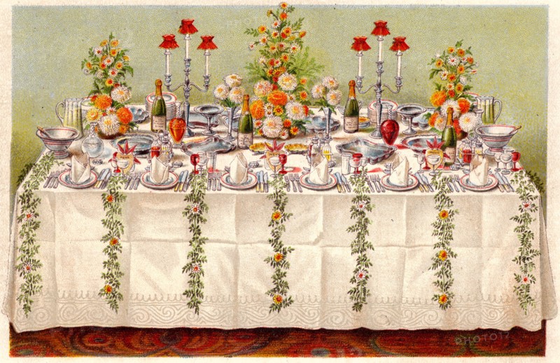Table covered with a linen cloth and set for a buffet for ball or an evening party