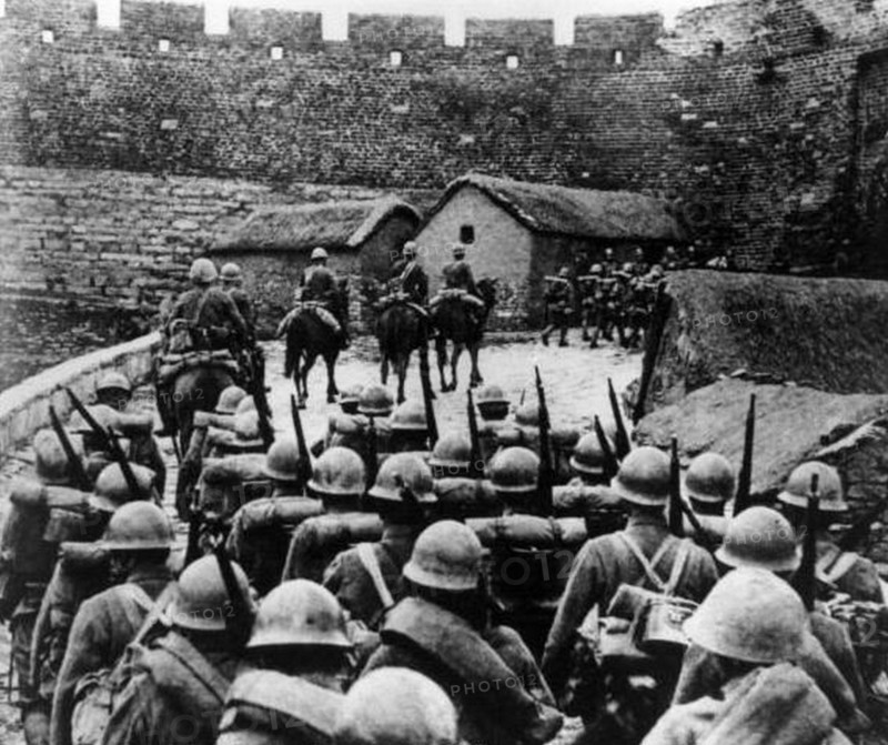 Japanese soldiers enter a city in China, Circa 1937