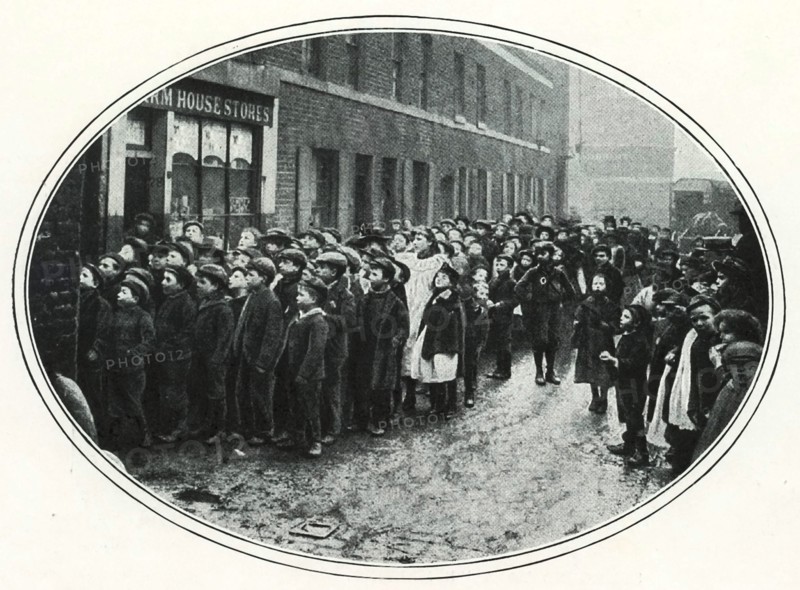 School children in the East End of London queueing for free meals, c1910