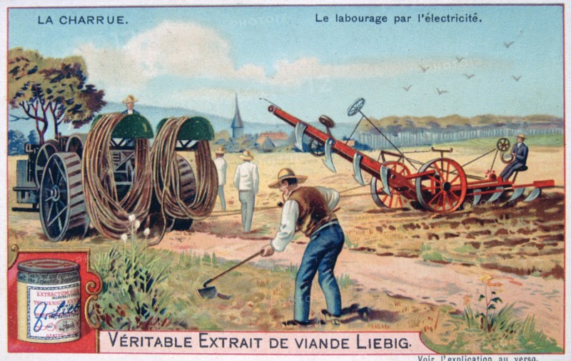 Electric plough being dragged across a field