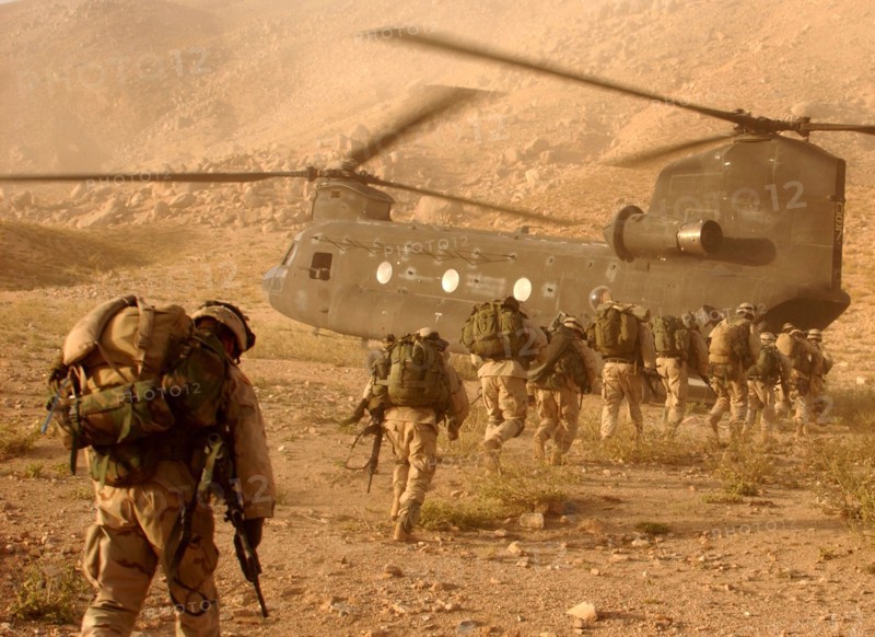 Soldiers board a Chinook helicopter in the invasion of Afghanistan 2001