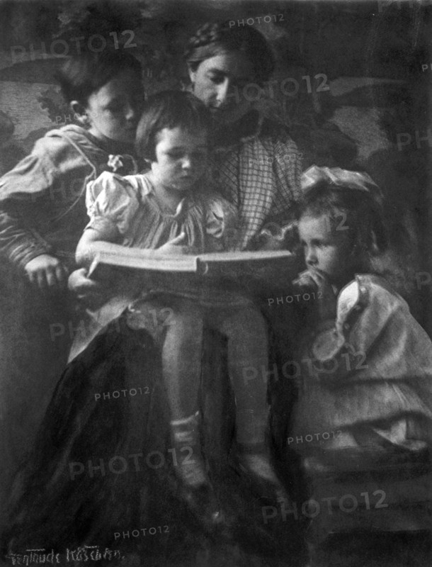 Woman and children reading
