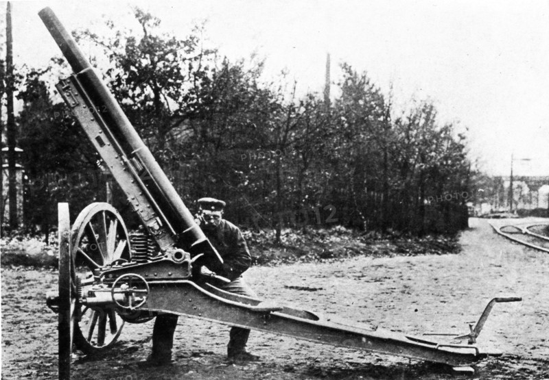 A German 21-centimeter siege mortar with caterpillar wheels
