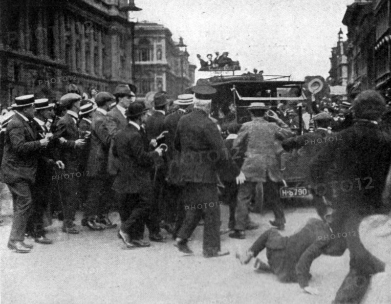 Cheering crowd surrounding the car of Mr Asquith