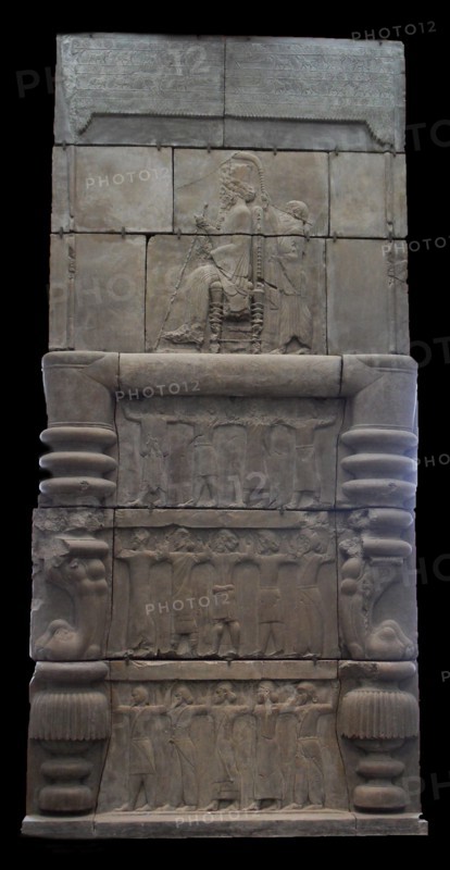 cast of Xerxes  sitting on a throne holding a sceptre and lotus flower