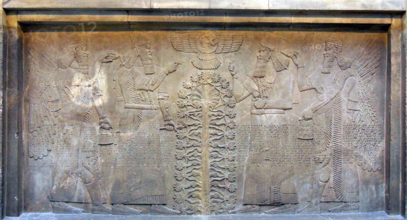 King Ashurnasirpal shown in a dual depiction at the Sacred Tree
