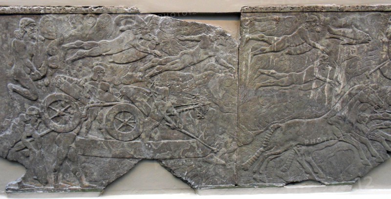 King Ashurnasirpal leads an attack on an enemy town