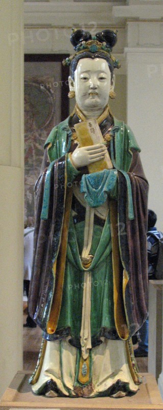 Stoneware figure from a judgement group with aubergine