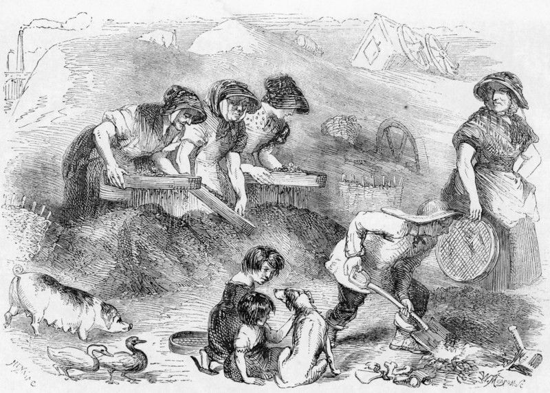 Women and children sifting household refuse in a dust yard