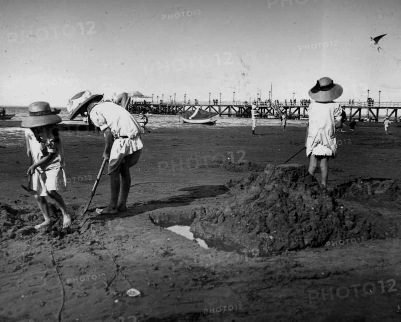young French children play on a beach