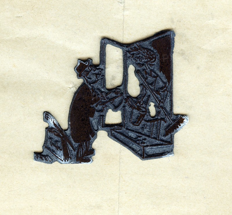 Lead block used to print a cartoon in a newspaper