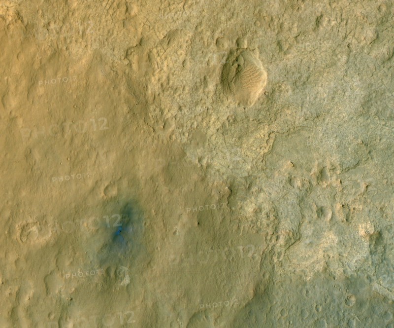 This color-enhanced view of NASA's Curiosity rover on the surface of Mars was taken by the HiRISE on NASA's Mars Reconnaissance Orbiter as the satellite flew overhead.