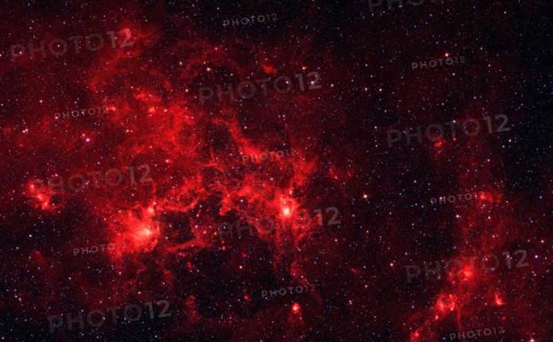 The nebula nicknamed 'the Dragonfish.' This turbulent region, jam-packed with stars, is home to some of the most luminous massive stars in our Milky Way galaxy. It is located approximately 30,000 light-years away in the Crux constellation. Spitzer.