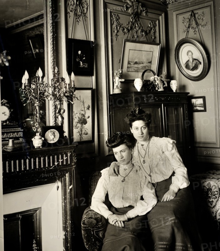 French sisters photographed in a domestic scene circa 1895