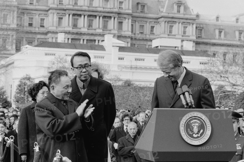Chinese Vice Premier Deng Xiaoping applauds as US President Jimmy Carter, 1979