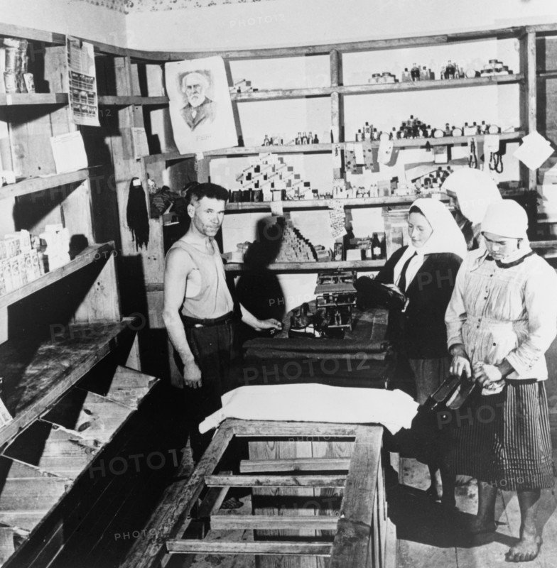Soviet women in a Russian store looking at shoes, 1951