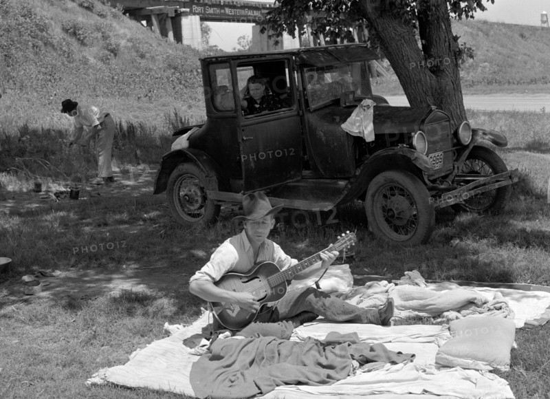Camp of migrant workers near Prague, Oklahoma. Lincoln County by Russell Lee, 1903-1986, dated 19390101.