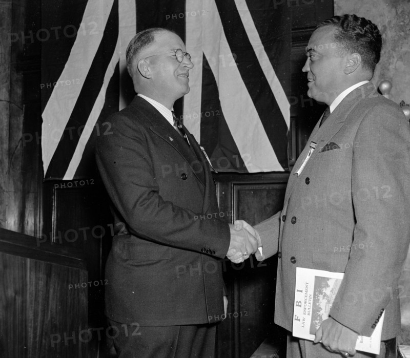 J. Edgar Hoover is greeted by Arthur Muchow