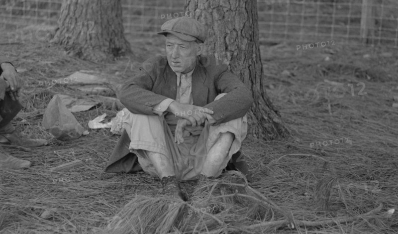 Migrant worker resting along roadside, Hancock County, Mississippi By Russell Lee, 1903-1986, photographer Date 19380101.