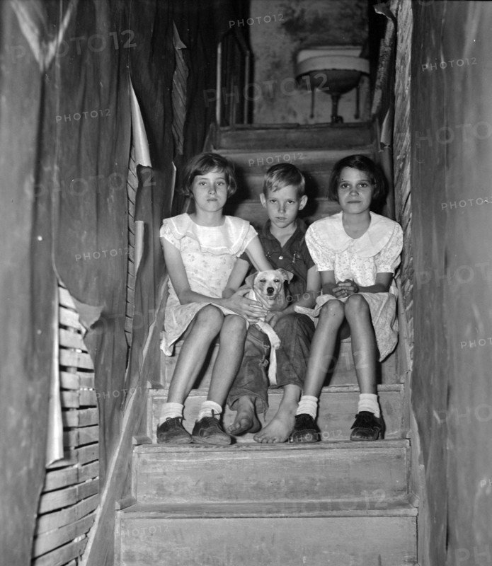 Children of migrant citrus worker who lives in a rundown apartment house. Florida 19370101