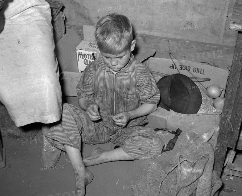 Son of white migrant worker in tent home near Harlingen, Texas 19390101