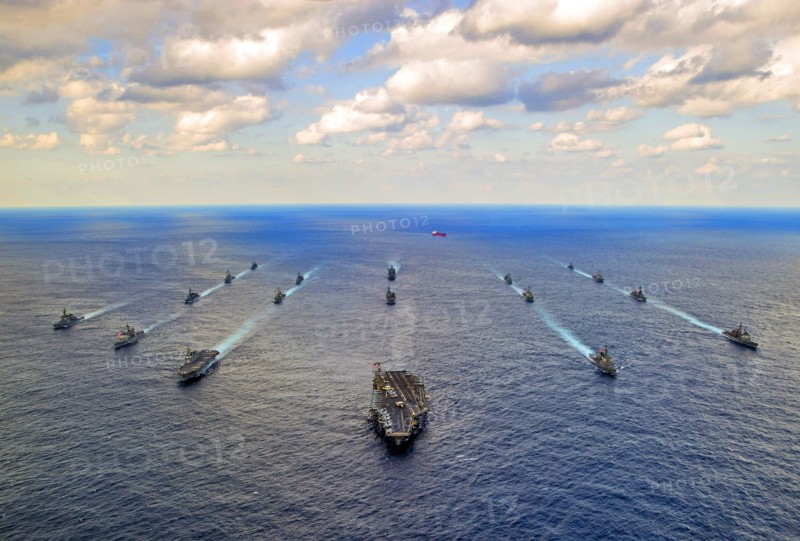 Photograph of Navy and Japan Maritime Self-Defence Force ships transit in formation at the conclusion of Keen Sword 15, a joint/bilateral field training exercise involving U.S. military and the Japan Self-Defence Force to increase combat readiness and interoperability