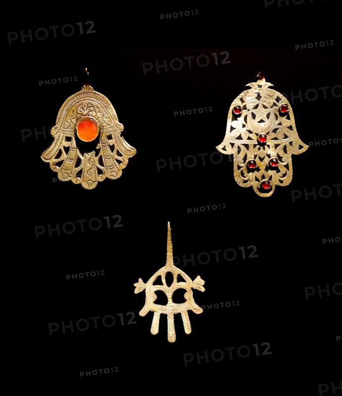 Gold palm shaped amulet, known as, the Hamsa throughout the Middle East and Africa