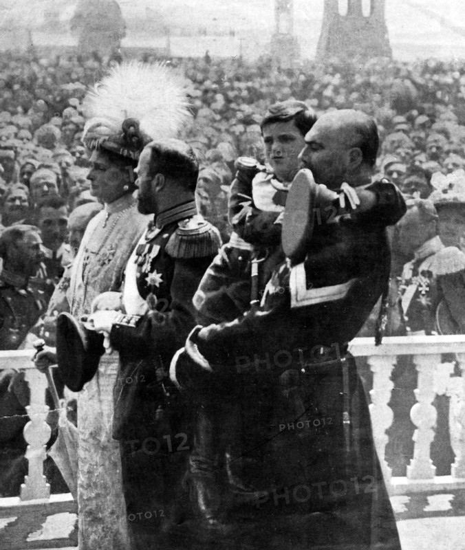 Photographic print of The last Emperor of Russia Nicholas II with his wife Empress Alexandra and their son Alexei, being held by a Cossack